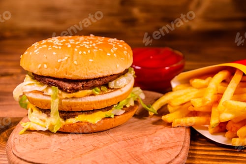 Preview: Hamburger And French Fries On Rustic Wooden Table