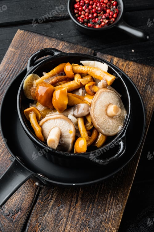 Preview: Wild Mushrooms Boletus Edulis And Cap Boletus In A Jar Set, On Black Wooden Table Background