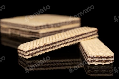 Preview: Lot Of Whole Sweet Chocolate Biscuit Wafer Two In Focus Isolated On Black Glass