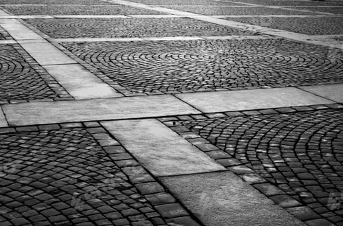 Preview: Cobblestone Sidewalk Made Of Small Stones. Black And White.