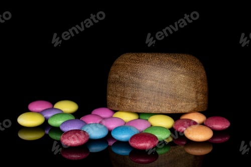 Preview: Lot Of Whole Sweet Colourful Candy In Bamboo Bowl Isolated On Black Glass
