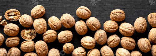 Preview: Walnuts On Black Background, Overhead View. From Above, Top View, Flat Lay. Closeup.