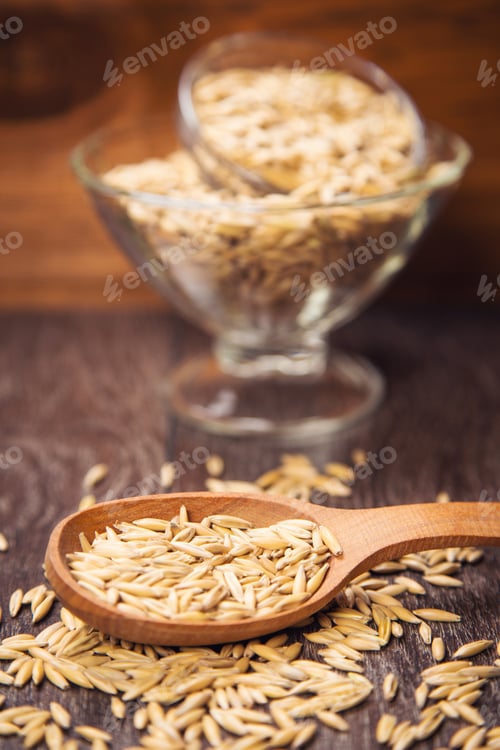 Preview: Ripe Dry Oat Is In A Wooden Spoon, In A Studio