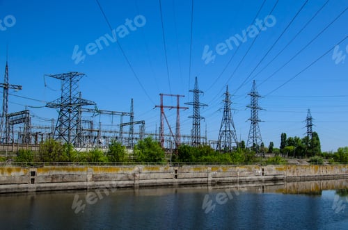 Preview: High Voltage Power Lines And Towers Against Blue Sky