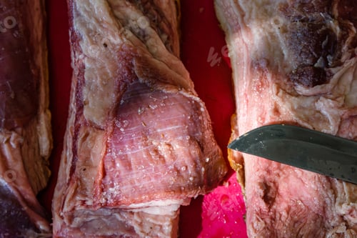 Preview: Raw Piece Of Pork Belly And Knife On Cutting Board