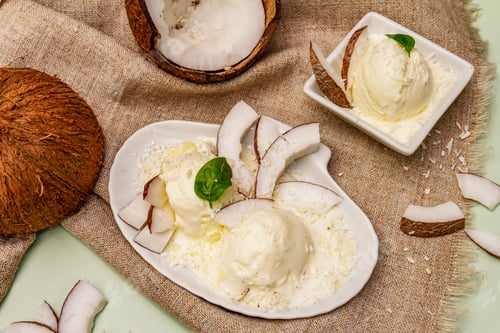 Preview: Lactose Free Coconut Ice Cream. Special Spoon, Halves Of Fruit, Flakes. Vegan Dessert Concept