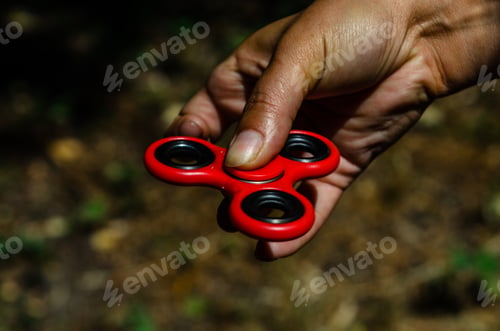 Preview: Red Fidget Spinner In A Female Hand
