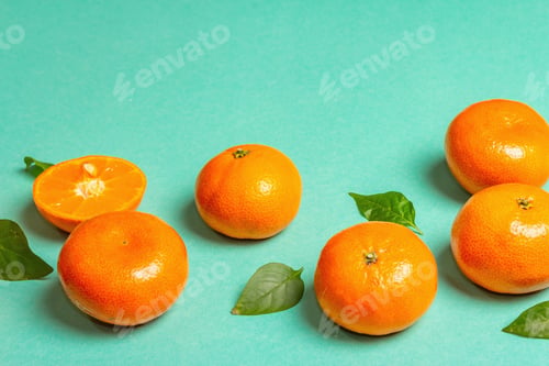 Preview: Ripe Juicy Tangerines And Fresh Leaves. Sunny Summer Turquoise Background, Copy Space