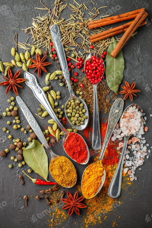 Preview: Variety Of Natural Spices, Seasonings And Herbs In Spoons On The Stone Table - Paprika, Curry