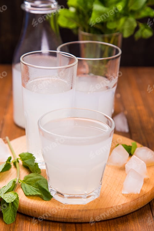 Preview: Fresh Soda Drink With Ice And Mint On Wooden Background