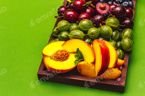 Preview: Assorted Fresh Fruits On A Plate. Ripe Berries Of A Cherry, Gooseberry, Blueberries, Slices Of