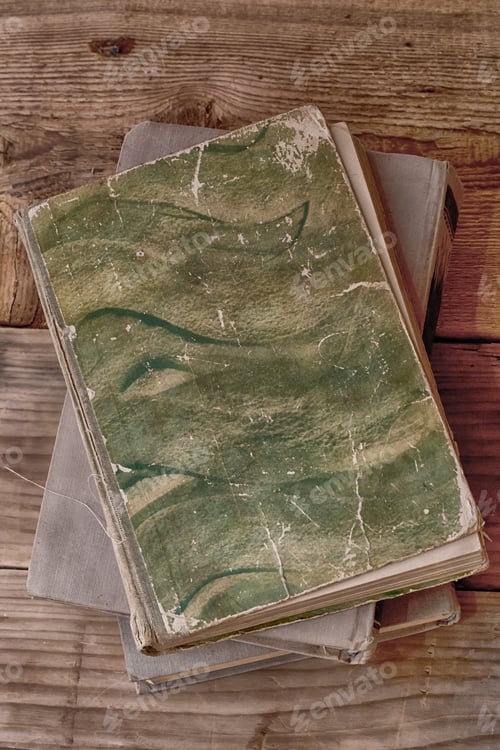 Preview: Old Books On A Wooden Background