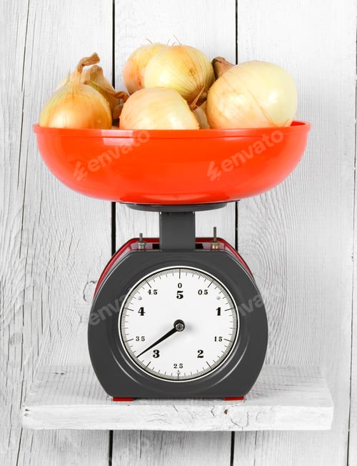 Preview: Onions On Scales On A Wooden Shelf.