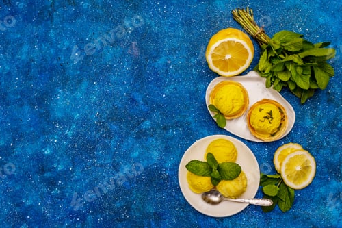 Preview: Lemon Ice Cream With Mint. Refreshing Summer Dessert, Ripe Fruit, Fragrant Leaves. Navy Blue