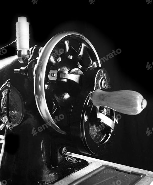 Preview: The Sewing Machine On Black Background.