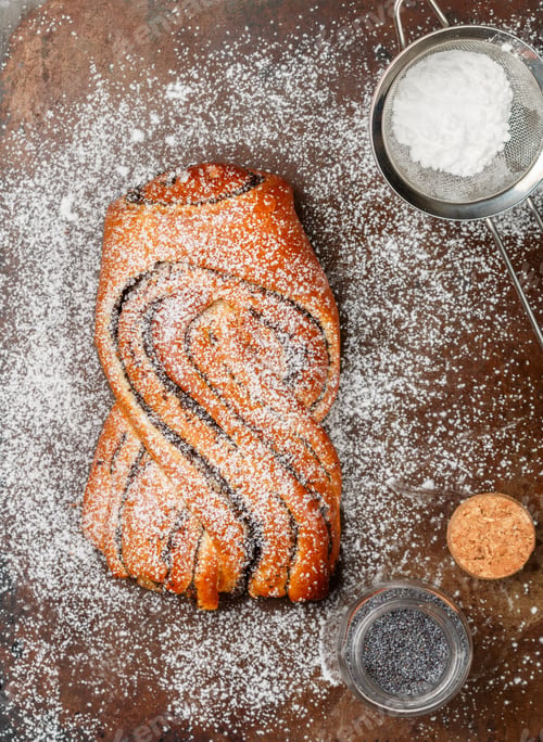 Preview: Homemade Freshly Baked Braided (Wicker) Pie With Poppy Seed Filling And Powdered Sugar. Fresh