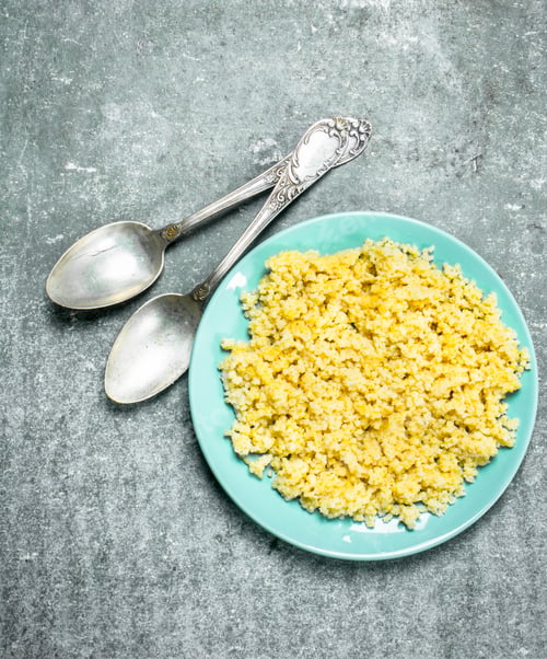 Preview: Millet Porridge With Butter. On Rustic Background.