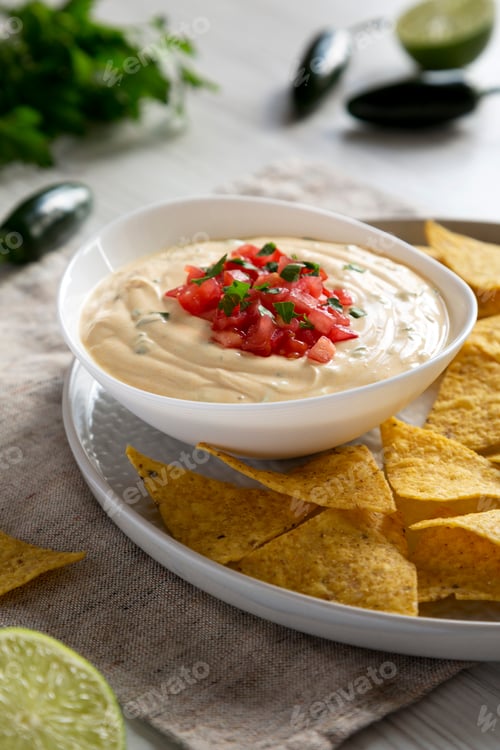 Preview: Homemade Cheesy Dip, Yellow Tortilla Chips, Side View. Close-Up.