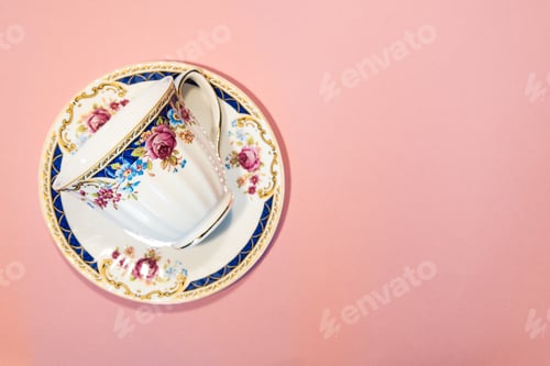 Preview: Empty Coffee Cup And Saucer Isolated On Pastel Pink Background With Copy Space. Top View Of Vintage