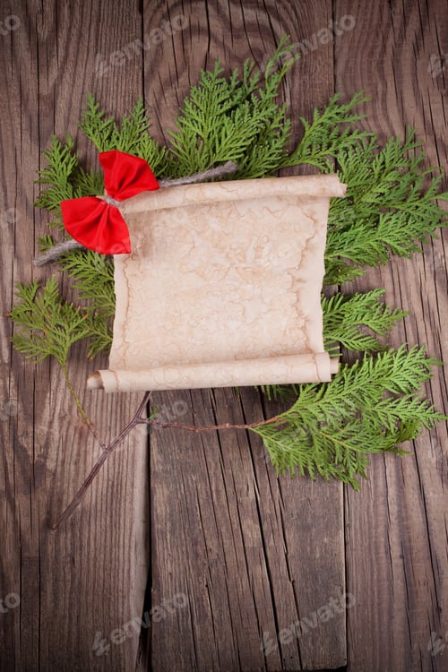 Preview: Sheet Of Paper With Christmas Decoration On Wooden Background