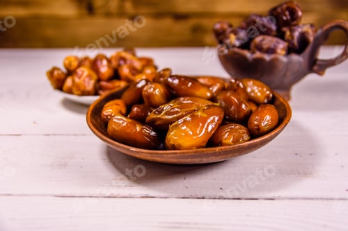 Preview: Date Fruits On A White Wooden Table