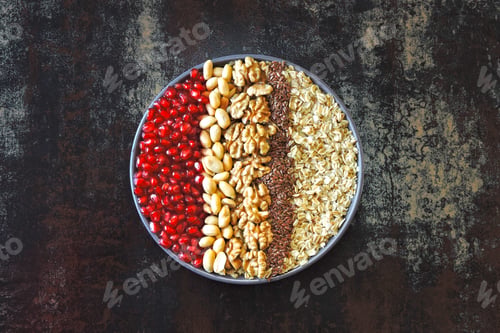 Preview: Vegan Breakfast Bowl Of Oatmeal, Nuts And Pomegranate. Healthy Breakfast Concept.