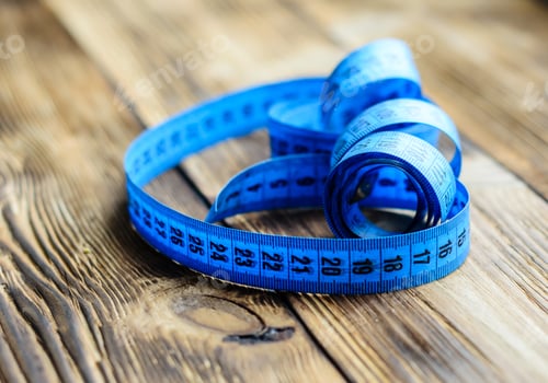 Preview: Blue Measuring Tape On A Wooden Background