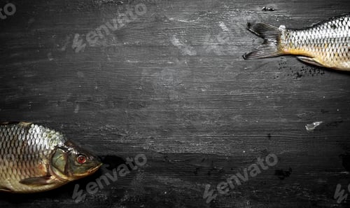 Preview: Raw Fish. On A Black Wooden Background.