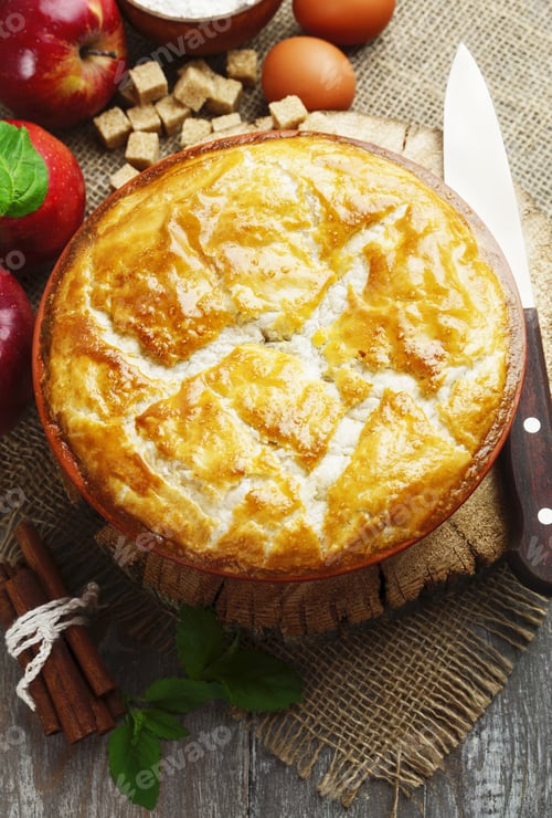 Preview: Pie And Red Apples On A Wooden Table