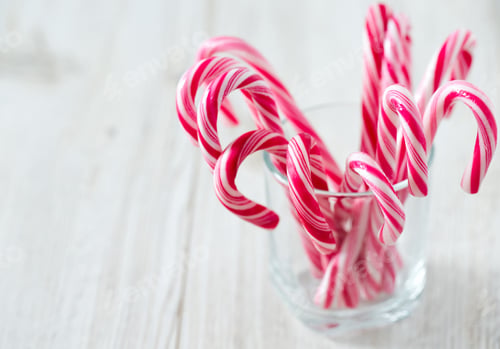 Preview: Striped Christmas Candies On Wooden Surface