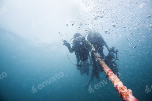 Preview: Scuba Divers Descending On A Descent Line