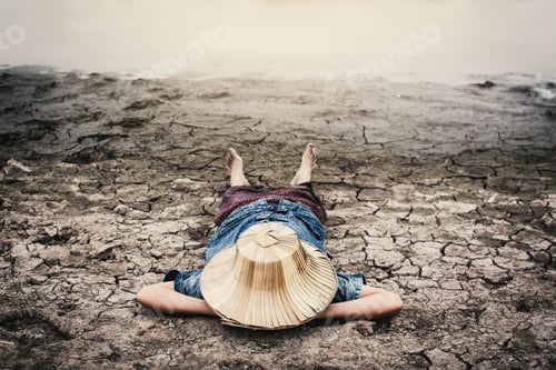 Preview: Sad Girl And Exhausted On Cracked Dry Ground, Concept Drought And Shortage Of Water Crisis