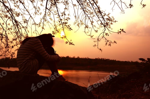 Preview: Silhouette A Girl Feeling Down On Sunset. Vintage Tone