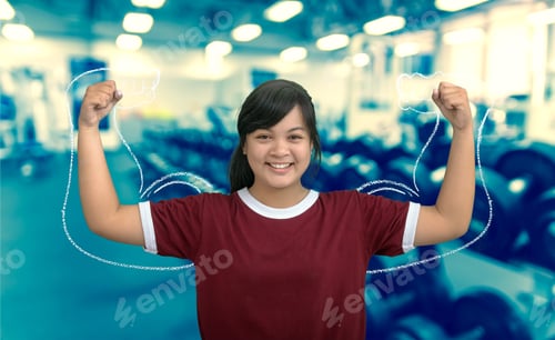 Preview: Asian Strong Girl Teenage On Abstract Blurred Photo Of Fitness Gym Background.
