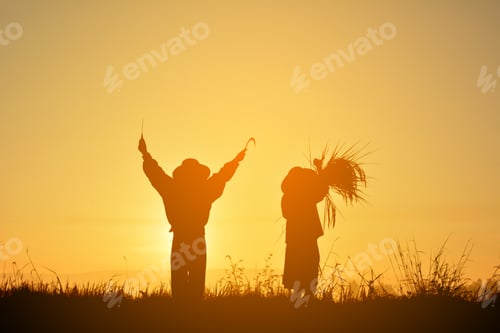 Preview: Silhouette Of Farmer Holding Rice And Sickle On Field In Harvest Season,Happy Farmer At Sky Sunrise