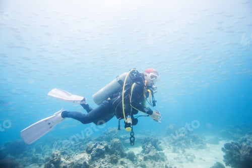 Preview: Diver Swimming In Fish School In Dimakya Island, Palawan, Philippines.