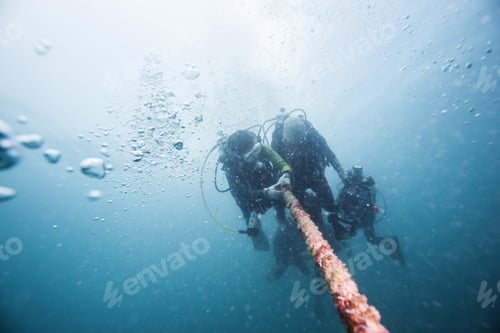 Preview: Scuba Divers Descending On A Descent Line