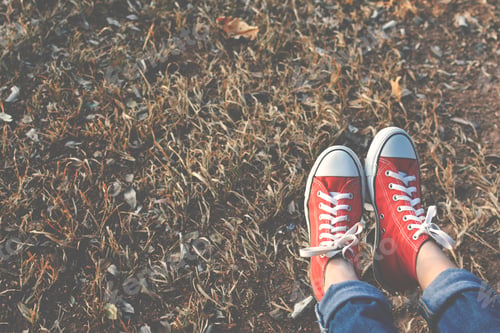 Preview: Feet Red Sneaker A Girl In Nature And Relax Time On Holiday. Selective And Soft Focus Color Of