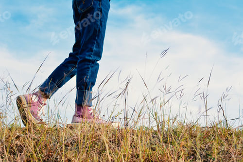 Preview: Happy Asian Girl Standing In Grass And Blue Sky Background, Relax Time On Holiday Concept Travel