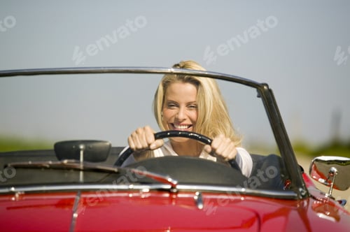 Preview: Woman Driving Convertible In Countryside