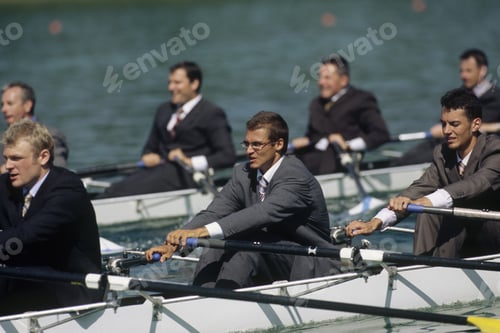 Preview: Team Of Rowers In Business Suits