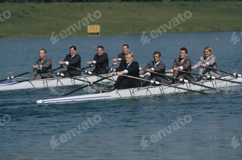 Preview: Team Of Rowers In Business Suits
