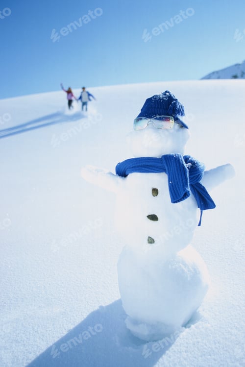 Preview: Couple In Distance Approaching Snowman