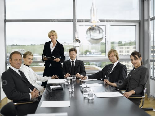 Preview: Businesspeople Having Meeting At Conference Table