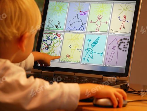Preview: Young Boy Painting Digitally On A Laptop
