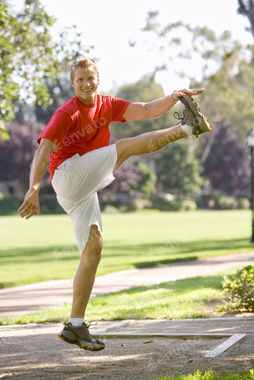 Preview: Man Kicking Leg Up In Park