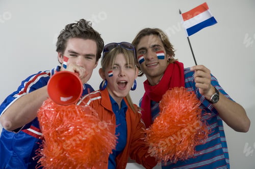 Preview: Sports Fans With Flags Painted On Faces And Pom-Poms