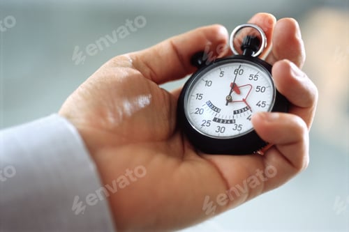 Preview: View Of Man Holding Stopwatch