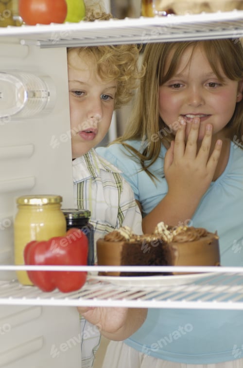 Preview: Brother And Sister Looking At Cake