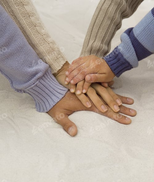 Preview: Close Up Of Parent’S And Children’S Hands On Beach